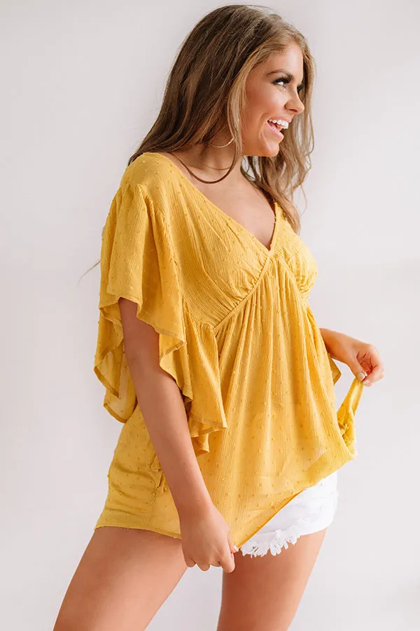 Ahead Of The Curve Babydoll Top In Marigold